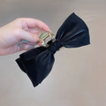 Detail of a large black satin mesh bow hair claw clip with beads for thick hair volume - Iridescent Bow Black
