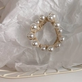 Close-up of elegant beige woven elastic hair tie with large white pearls in a basket - 1# Pearl