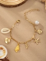 Golden ocean theme bracelet featuring starfish, shells, and white pearl charms - Letter Y(Y)