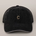 Detailed view of metal C letter and distressed washed cotton denim baseball cap texture - Black