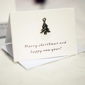 Mini textured paper Christmas card featuring a bronze metal Christmas tree pendant - Christmas Tree