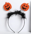 Detail of Halloween headband with orange sequined pumpkins and black feather trim - Black Feather Glitter Pumpkin