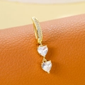 Golden belly button ring with two vertical heart-shaped clear zircons on orange leather - Double Heart 6.0 (Gold)