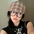 Close-up of red and brown plaid beret cap styled with black glasses and casual T-shirt - Red 19 Thin Stripe Plaid