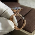 Two-tone rose gold engagement ring with round brilliant cut center stone and pave diamonds - Rose Gold