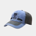 Detail of vintage husky patch embroidery and sawtooth stitching on a washed denim baseball cap - Blue