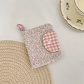 Detailed view of floral fabric coin purse with pink gingham flap and plastic loop - Floral Print