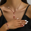 Elegant red rhinestone jewelry set with Y-necklace and earrings on a model - 446+428-1 Red Set