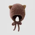 Detailed view of brown plush winter hat for kids with cat ears and chin straps - 3-6 Years / Brown