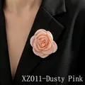 Detail of dusty pink fabric rose brooch XZ01 on a black blazer lapel with layered petals - Dusty Pink