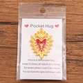 Pocket Hug gold alloy heart charm with red enamel on a white greeting card - Gold Alloy Enamel Heart