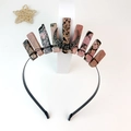 Detail of handmade crystal crown featuring pink and black stones with silver moon accent - Rhodochrosite Black Wire Moon
