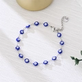 Detail of the blue evil eye beaded bracelet with silver lobster clasp and extension chain - Blue Eyes Silver