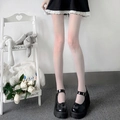 Women polka dot sheer tights paired with black platform shoes for a cute stylish look. - One Size / Solid White