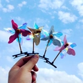 Lot de quatre barrettes à cheveux moulin à vent avec paillettes laser sur pinces bec de canard - 6 Feuilles Multicolore/Couleur Aléatoire