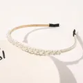Detail of elegant faux pearl headband with layered white beads on slim gold metal frame - Wrapped Mixed Size Pearls (Small)