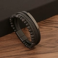 Detailed shot of multilayer leather bracelet with black stone beads on dark wood - Volcanic Stone 21CM