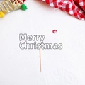 Detail of red Merry Christmas cake topper with white reindeer silhouette and wooden stick - Style G Merry Christmas