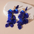 Detail view of deep blue acrylic petal tassel clip-on earrings with gold chains - Blue Petal Clip-on Earrings