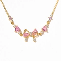 Bracciale dorato con zircone rosa a cuore e fiocco per uno stile femminile e romantico - Bracciale con Fiocco Oro