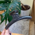 Detail of a large translucent dark grey hair claw clip showing its smooth resin texture - Butterfly Back Style / Extra Large (Approx. 15cm) / Dark Gray