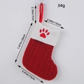 Classic red knitted Christmas stocking with white cuff and red paw print embroidery detail - Cat Claw Style