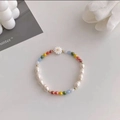 Colorful beaded pearl bracelet featuring baroque pearls and a white daisy flower charm - Colorful Daisy Pearl Bracelet