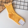Bright yellow mid-calf cotton socks with vertical ribbed texture and brand tag - One Size / Ginger Yellow