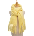Soft mohair winter scarf with tassels in yellow color displayed on wooden mannequin - Goose Yellow