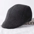 Detailed side view of dark grey herringbone wool flat cap for men with warm fabric texture - Large Herringbone / Dark Grey Herringbone