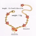 Bracelet doré avec pétales de fleurs rouges et pendentif nœud, chaîne de 13+7cm réglable - Or rouge