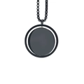 Close-up of black multilayer round pendant necklace with polished stainless steel chain - Rotating Round Tag / Black