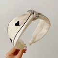 Beige satin wide headband with black heart pattern and sparkling rhinestone knot detail - Heart Pattern/Knotted Style / Heart Embroidery Beige