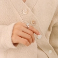 Vintage silver open ring with rectangular details on female hand wearing knit cardigan - US 7 / Steel