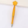 Golden metal ballpoint pen featuring a decorative plum blossom top on a white background - Flower / Orange
