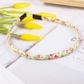 Floral fabric headband with pink blossoms on light green base and protective black ends - Light Green Floral
