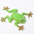 Green toy tree frog figurine with red eyes and textured skin for sensory play - Yellow Limbs