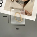Transparent 9x9cm EVA jewelry storage bag featuring a gold beaded bracelet inside - 50 Silk Frosted Zipper Bag / 9x9cm
