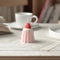 Pink strawberry cannelé pudding candle on a warm cozy desk with aesthetic book decor - Strawberry Pudding - Red Pink