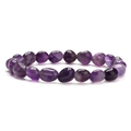 Natural amethyst beaded bracelet featuring irregular polished tumbled stones on white background - Amethyst