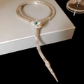 Detailed view of silver mesh snake necklace with green gemstone eyes on display box - 42# Necklace - Silver - Snake Rhinestone Green Eye