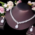 Macro detail of bridal jewelry set with marquise and teardrop cubic zirconia - Stud Pin Style / White