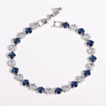 Detailed macro view of 18k gold plated copper beads with blue and clear zircon stones - 4mm Green Royal Blue White Gold