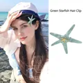 Teal starfish hair claw clip with marbled texture and gold starfish center for women - 5907 Golden Star Ocean Hair Clip-Blue