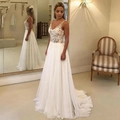 Elegante witte A-lijn trouwjurk met diepe V-hals kanten lijfje en vloeiende chiffon sleep - S(US 2) / Wit
