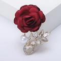 Elegant dark red fabric rose brooch with white pearl and rhinestone leaf in gold finish - Red