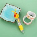 Mini 4-color Christmas ballpoint pen with yellow reindeer character top on green surface - Christmas Series 6-Yellow Snowman