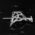 Detailed view of silver Celtic knot hair pin with carved dragon head on dark reflective surface - C1213-2#(Antique Silver Dragon Head)