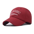 Detail of red cotton baseball cap with 3D white embroidery reading Classic Style Modern - Adjustable / Red