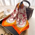 Elegant silk scarf in orange and white tied to a brown leather handbag handle - Red Yellow